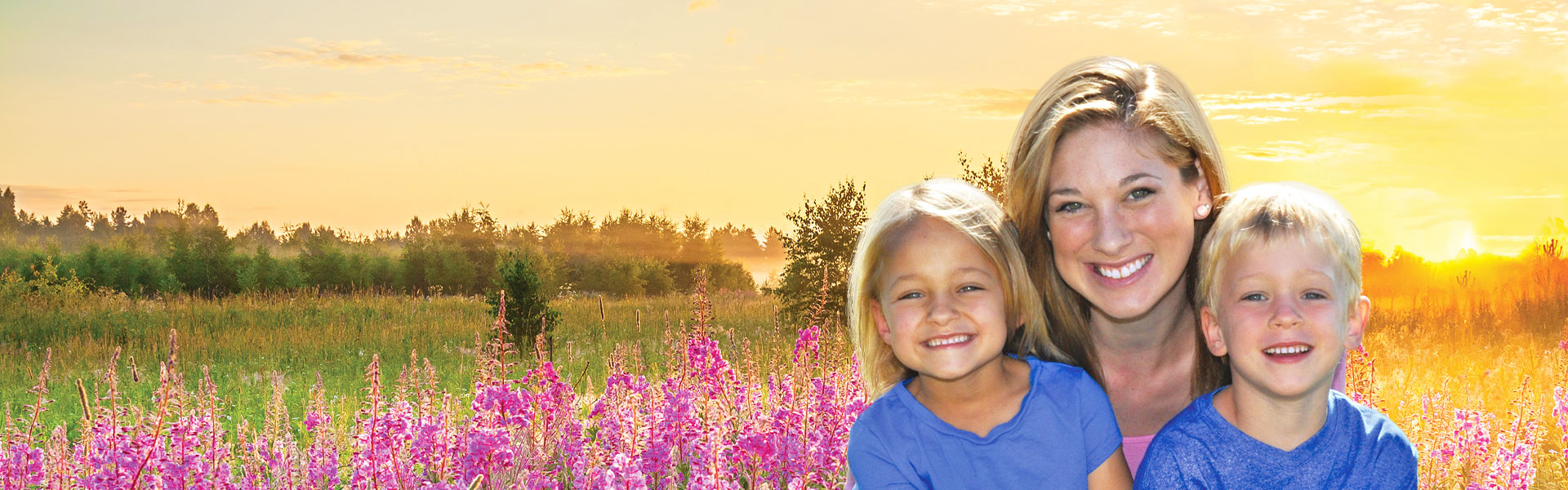 mother, daughter and son in flower field